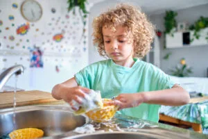 Child Helping in Kitchen